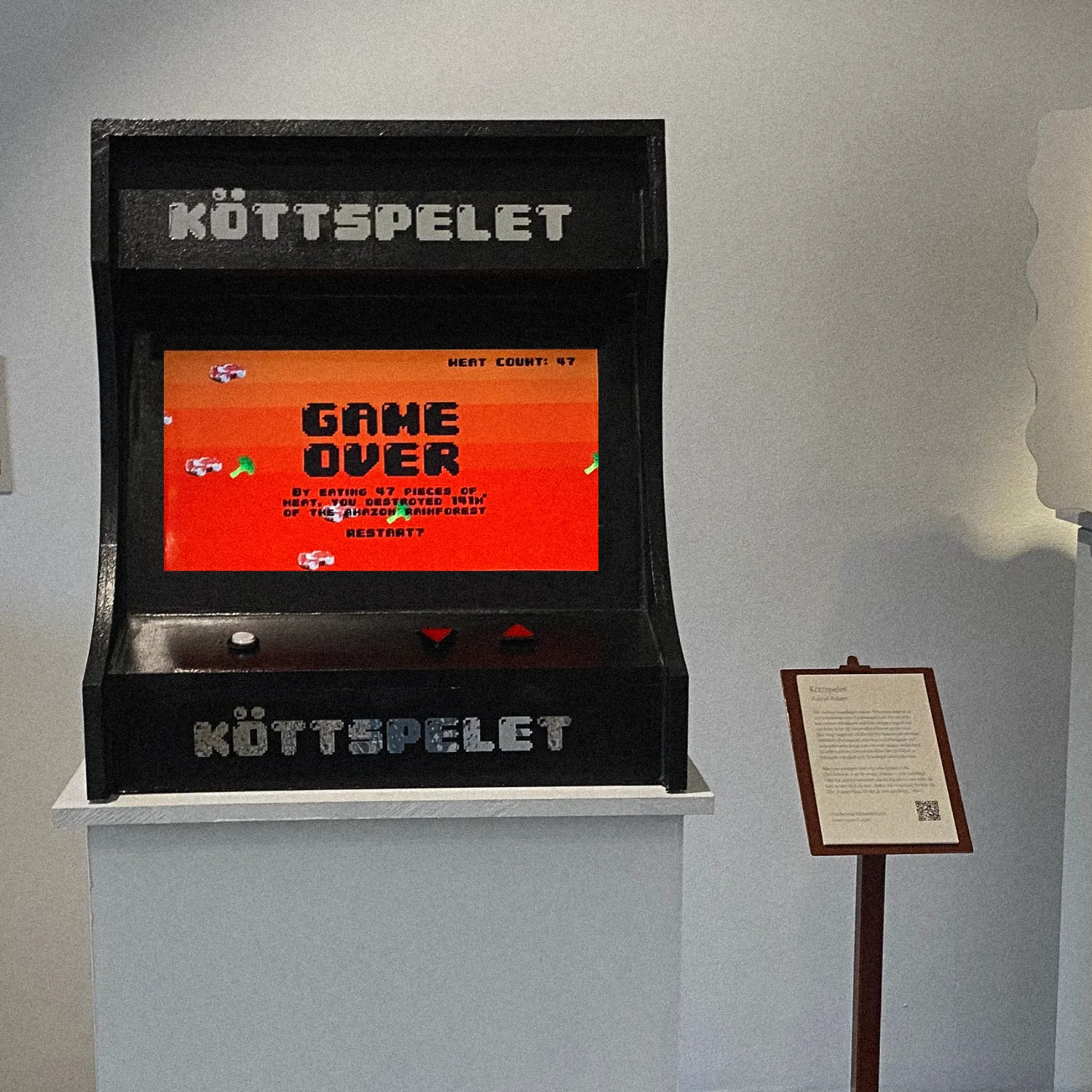 Köttspelet arcade cabinet showing the game over screen