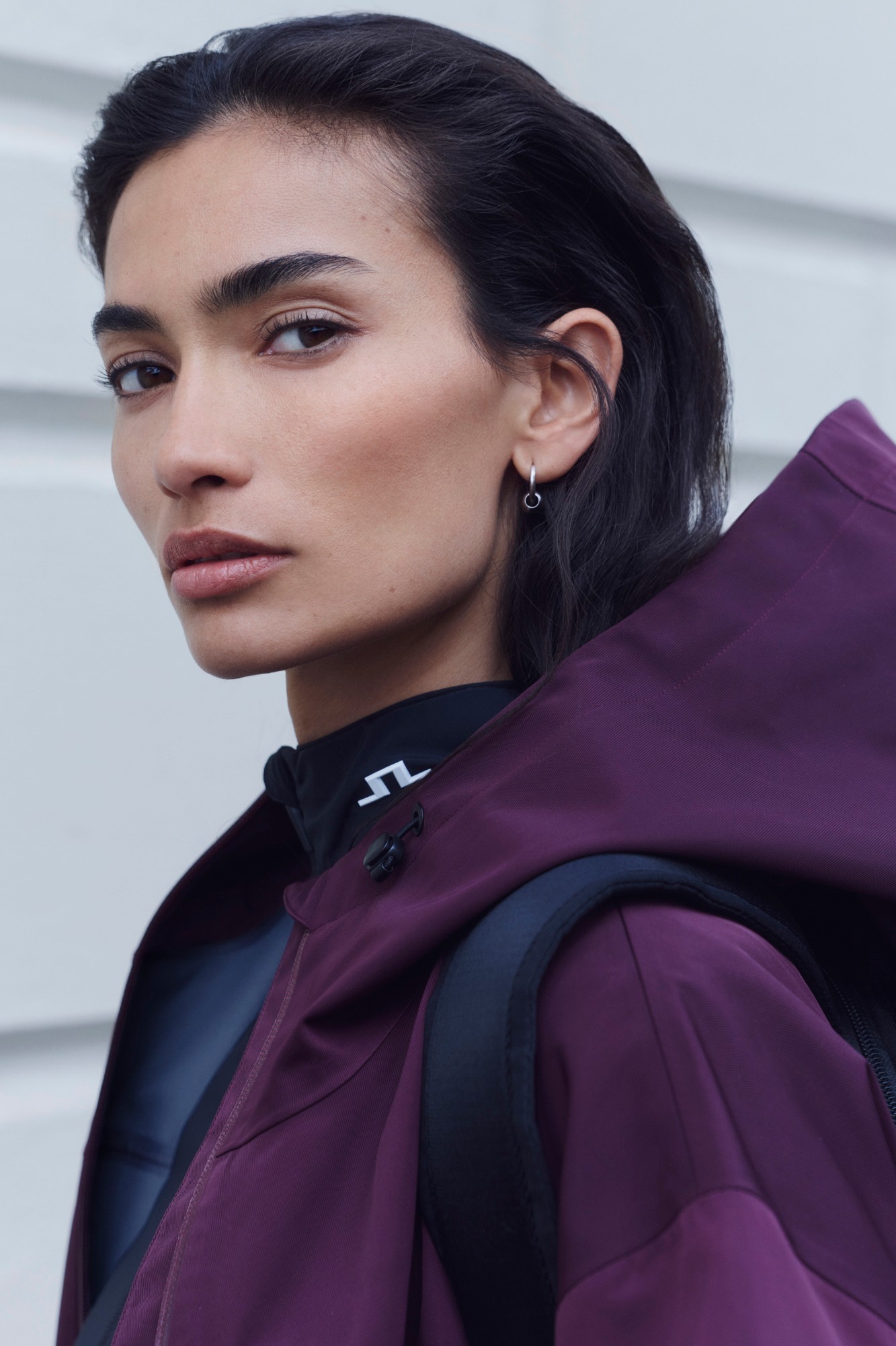 Close-up portrait of Kelly Gale in a plum J.LINDEBERG jacket